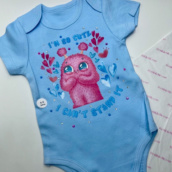 Cotton Candy Kendall on a Blue Onesie - Picture 1 of 2